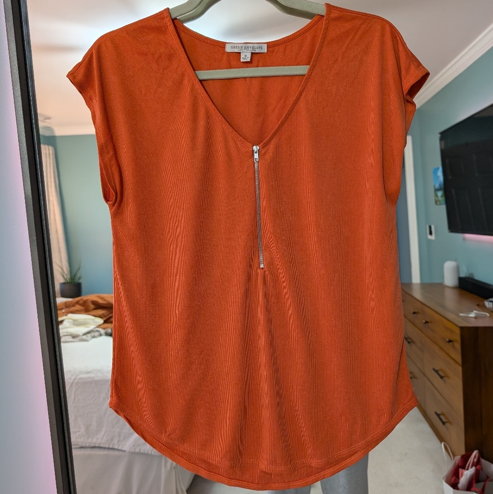 Orange zippered shirt